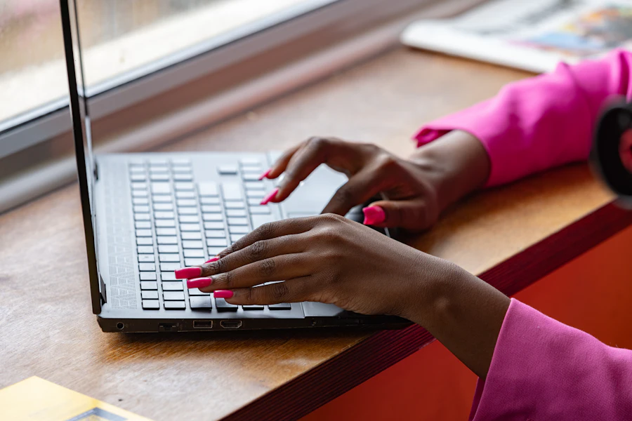 Woman using a laptop at a table