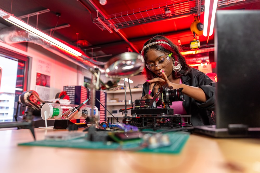 a woman working on a project in a lab