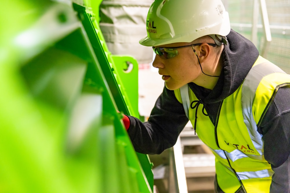 a man wearing a hard hat and safety gear