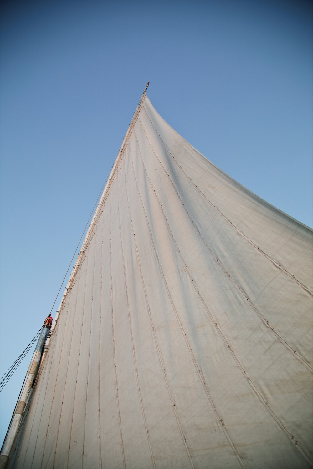 a person on a sailboat on a sunny day