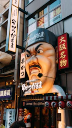 a giant statue of a man with a hat on his head