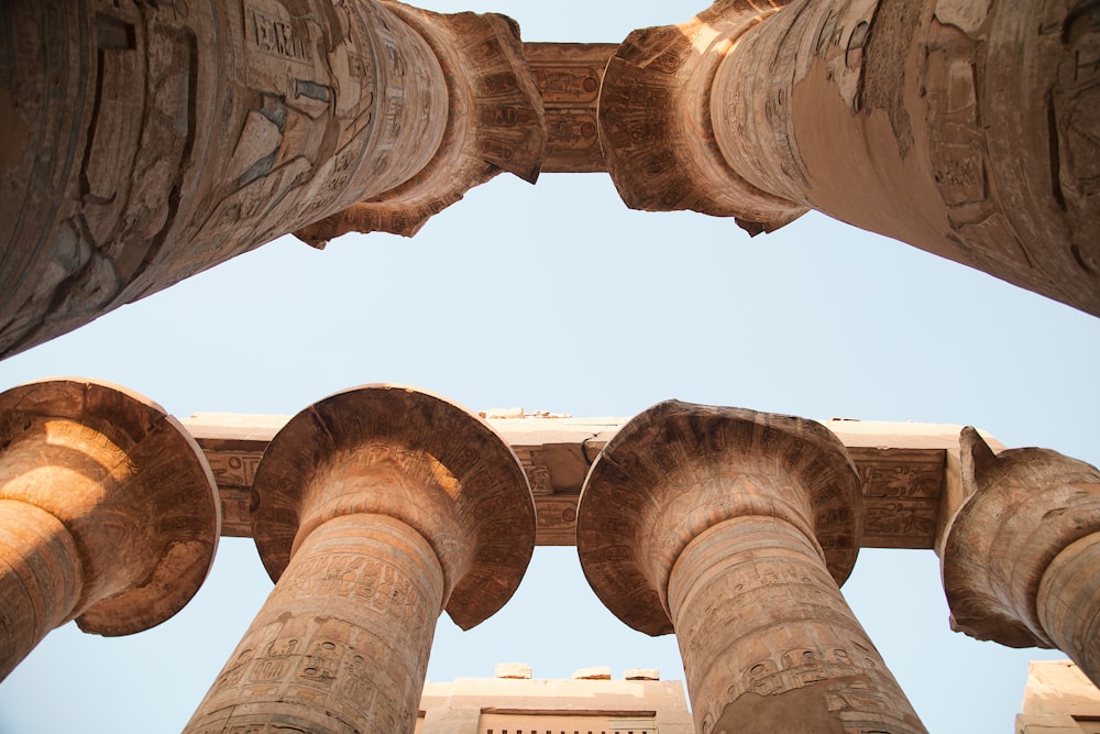 looking up at the pillars of a building