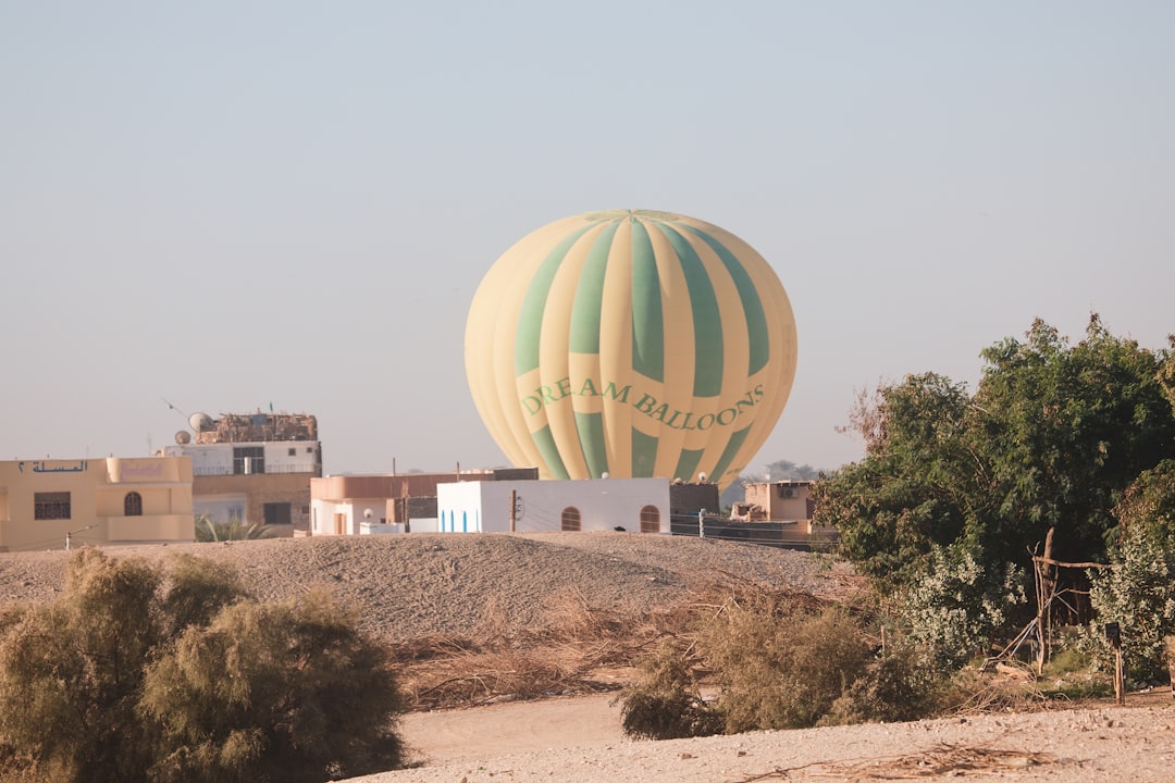a large hot air balloon in the middle of a desert,