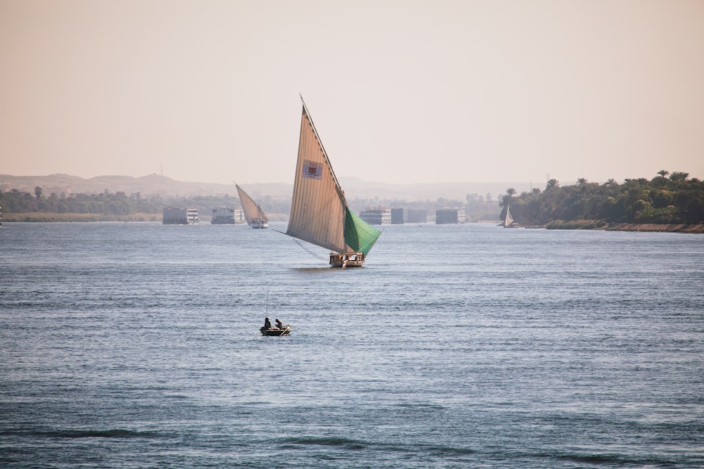 a couple of people on a small boat in the water