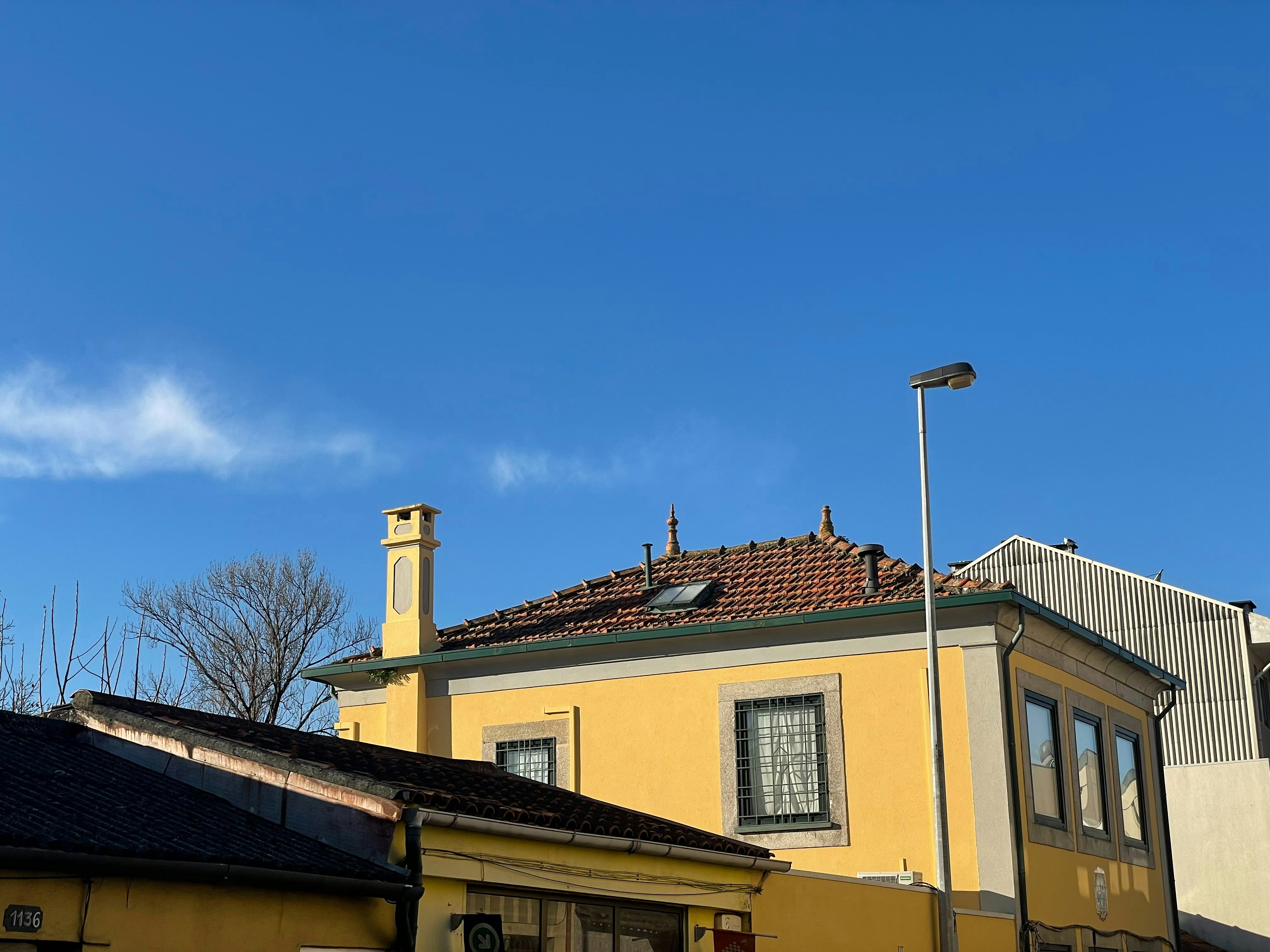 a yellow building with a clock tower on top of it