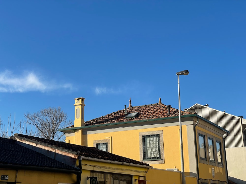 a yellow building with a clock tower on top of it