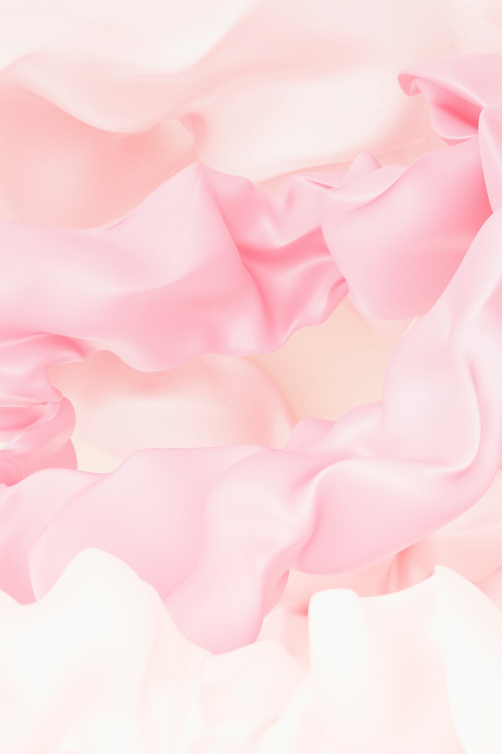 a close up of a pink and white blanket