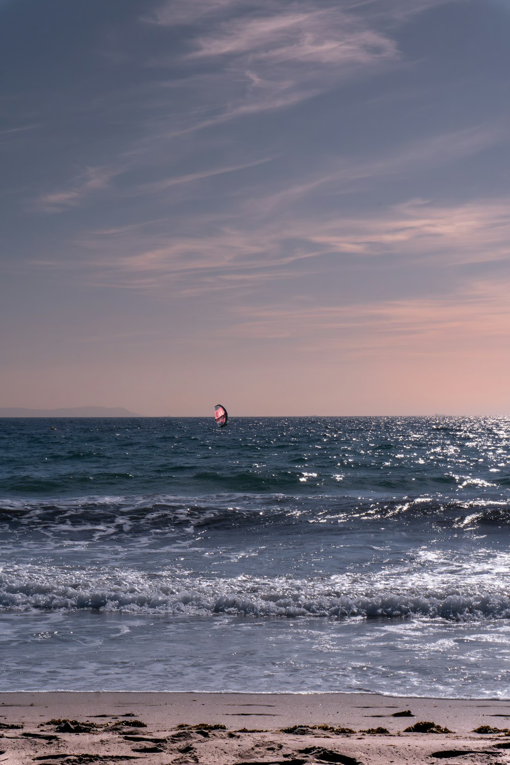 a person riding a surfboard on a wave in the ocean