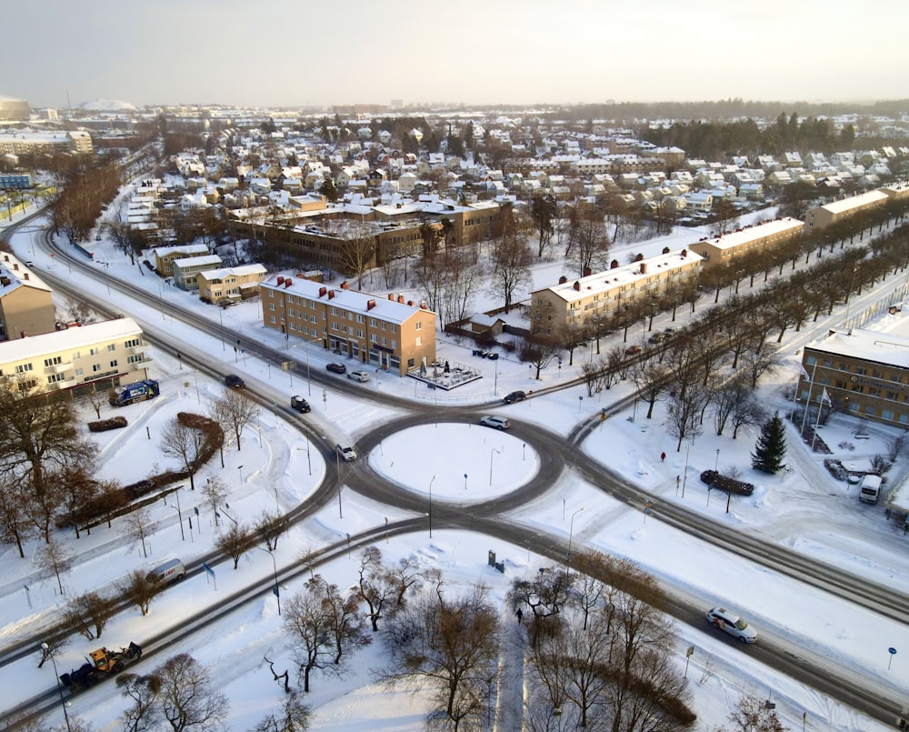 an aerial view of a snow covered city