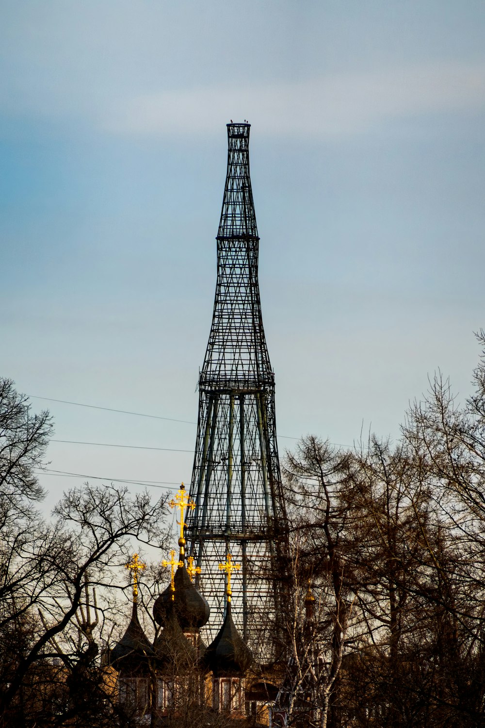 a very tall tower with a clock on it's side