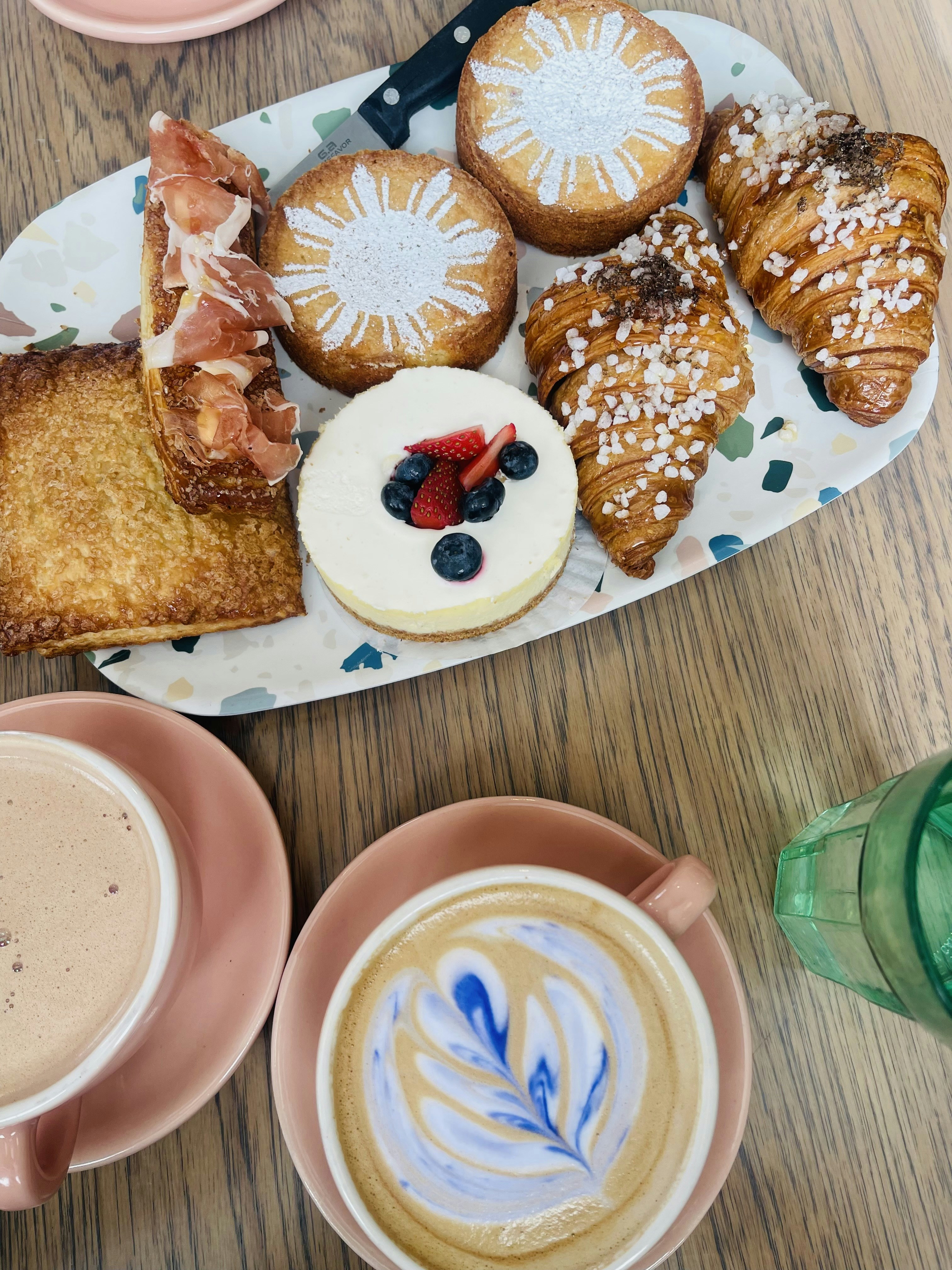 a plate of pastries and a cup of coffee on a table