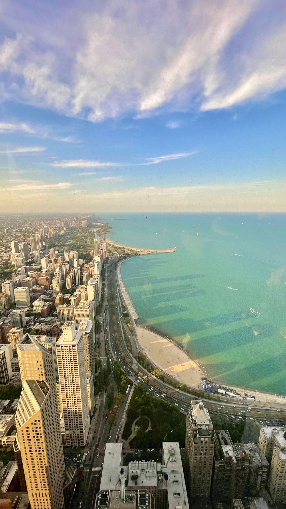 an aerial view of a city and the ocean