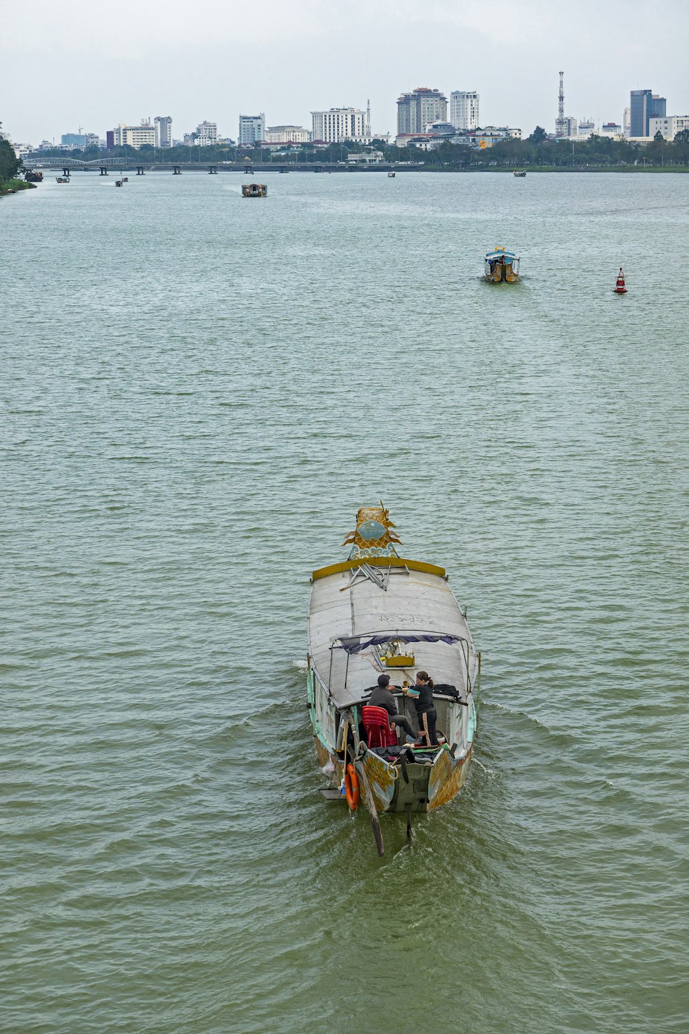 a small boat in the middle of a large body of water