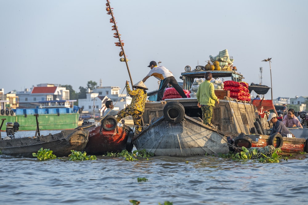 a group of people on a boat in the water