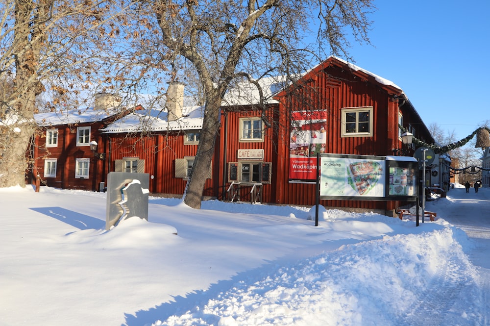 a red building with a sign in front of it