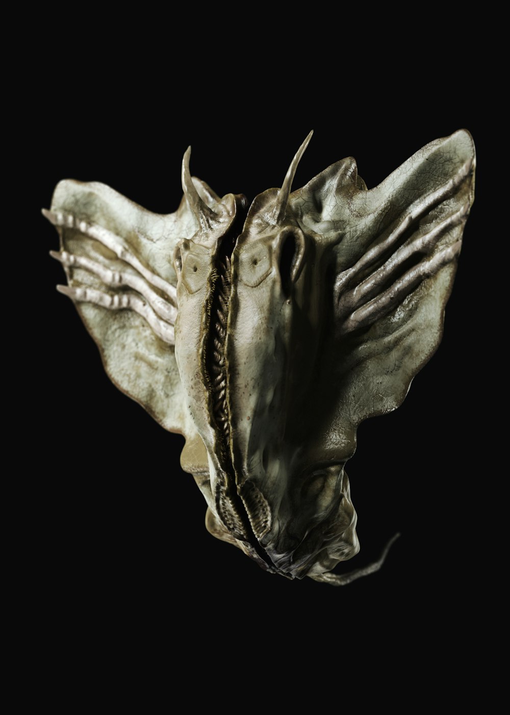 a close up of an alien head on a black background
