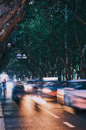 a blurry photo of cars driving down a street