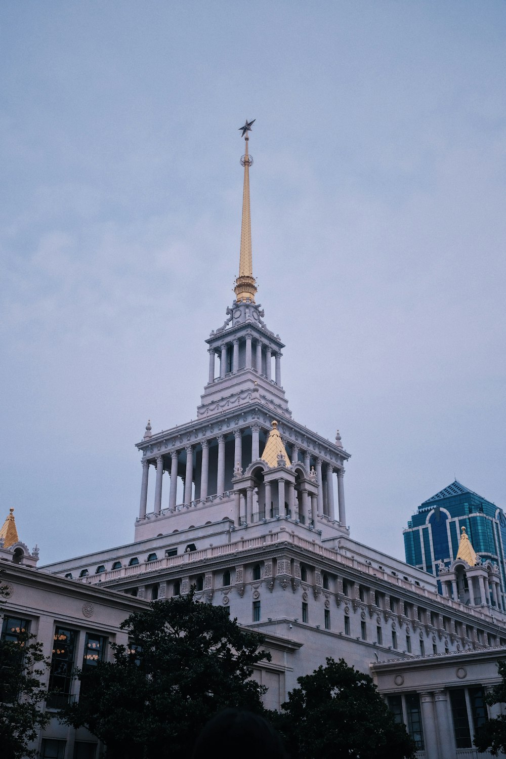 a very tall building with a gold spire