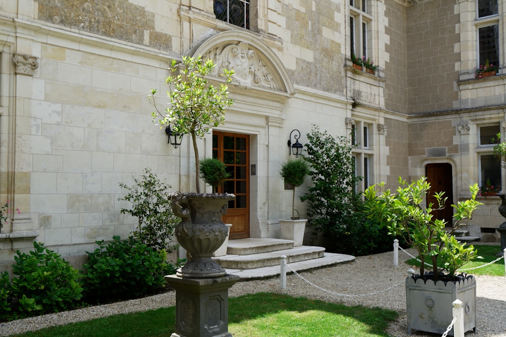 a large building with a fountain in front of it