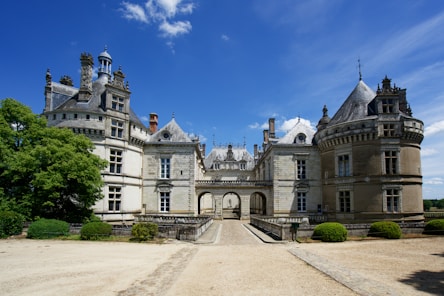 a large castle like building with a walkway leading to it