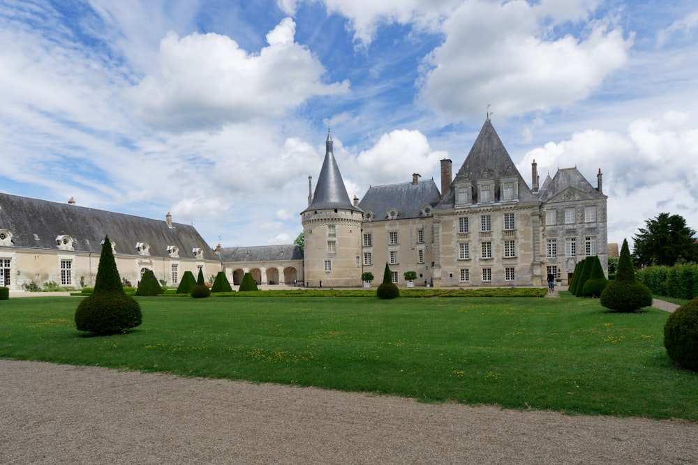 a large building with a lot of trees in front of it