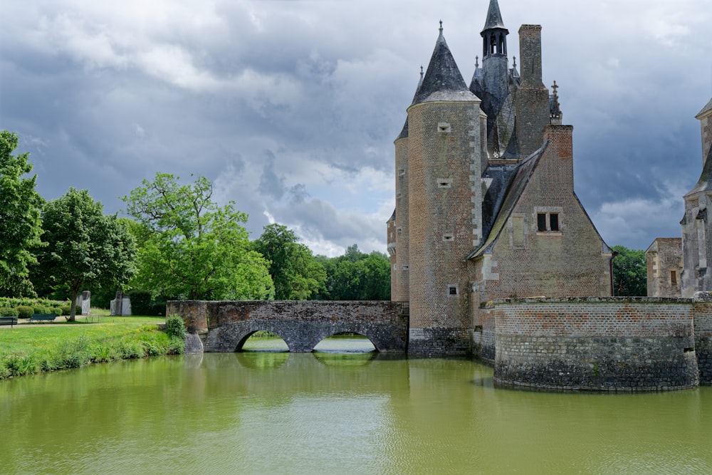 a castle with a bridge over a body of water