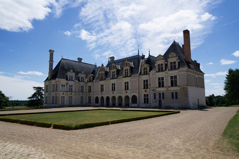 a large building with a large lawn in front of it