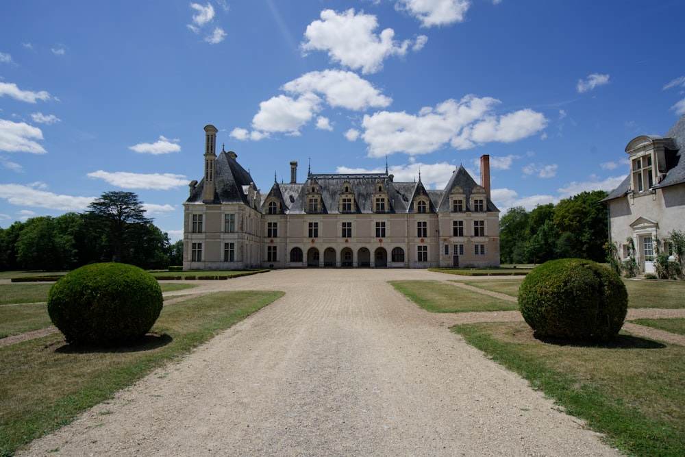 a large house with a large driveway in front of it