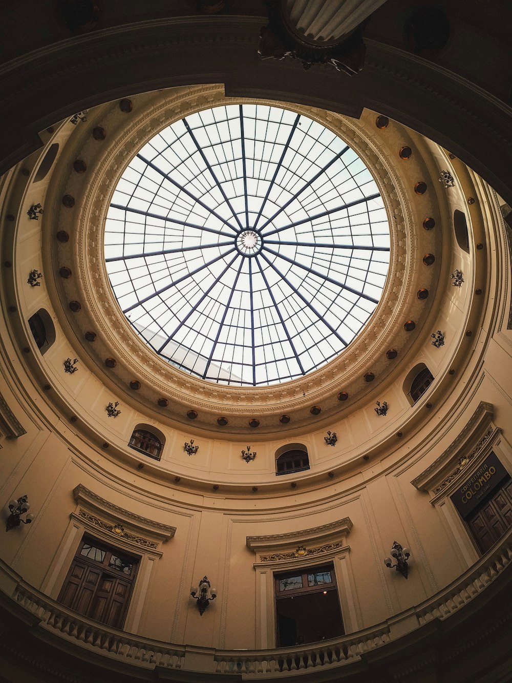 a circular glass ceiling in a building