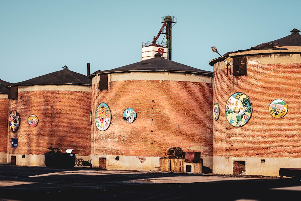 a brick building with a crane on top of it