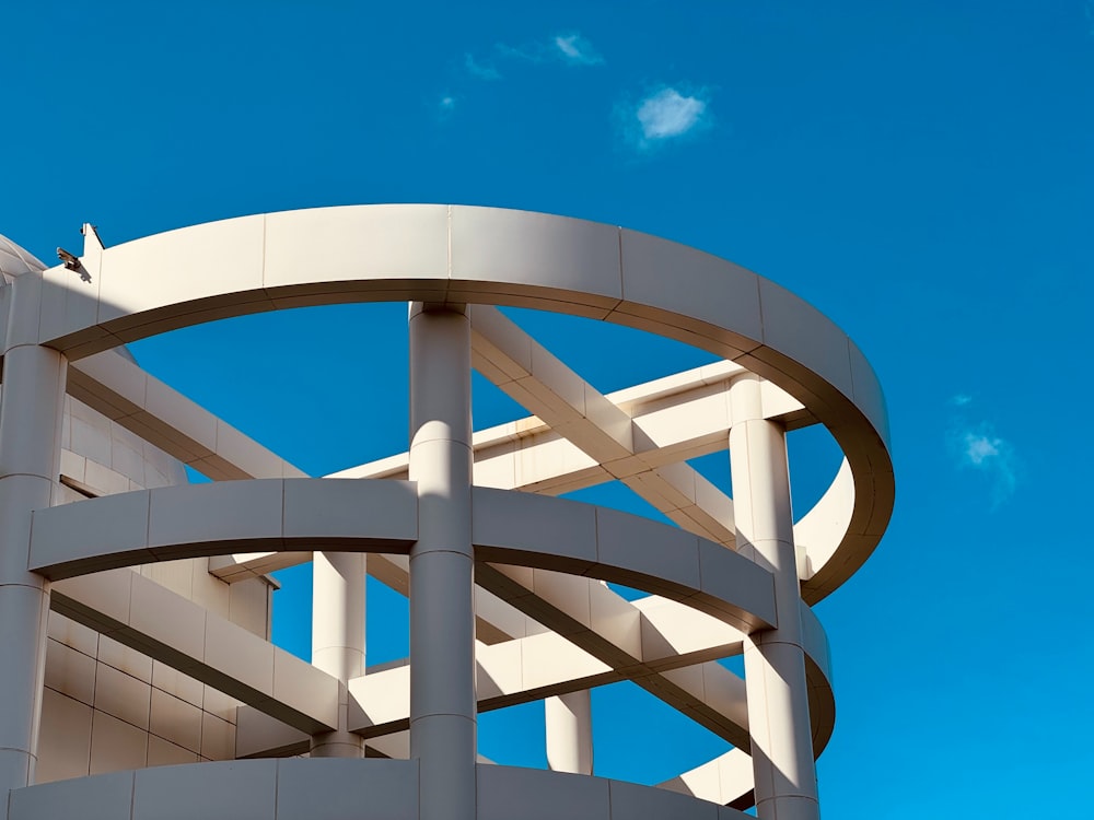 a white circular structure against a blue sky