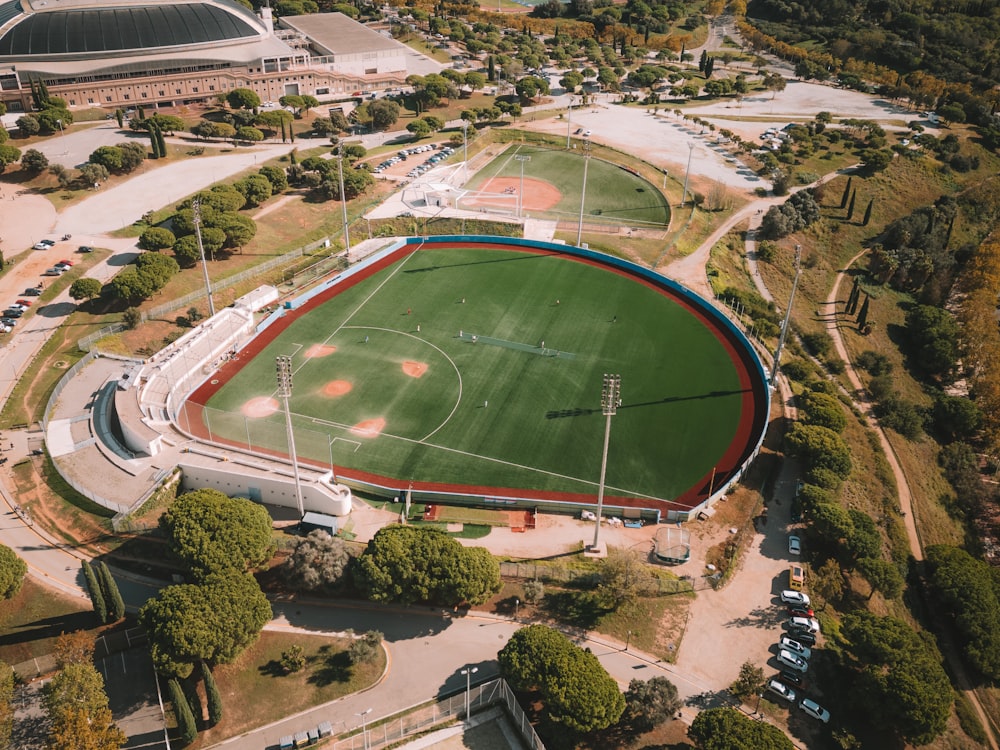 an aerial view of a baseball field in a city