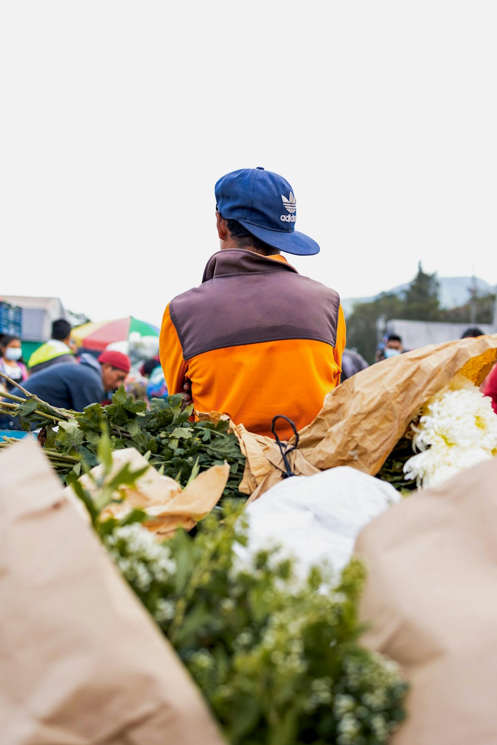 a person sitting on a pile of vegetables