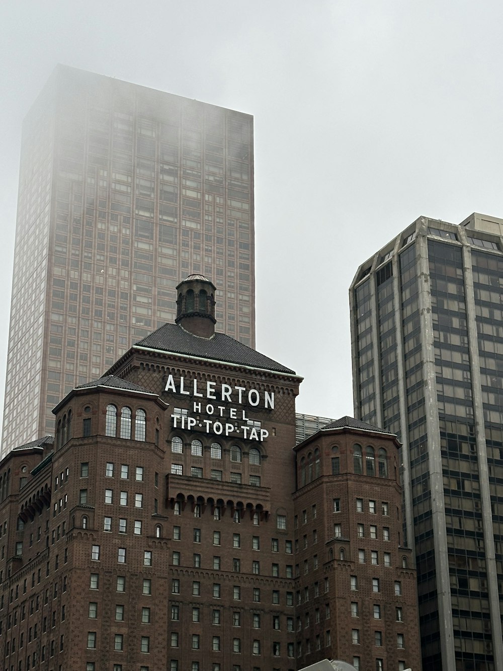 a tall building with a sign on top of it