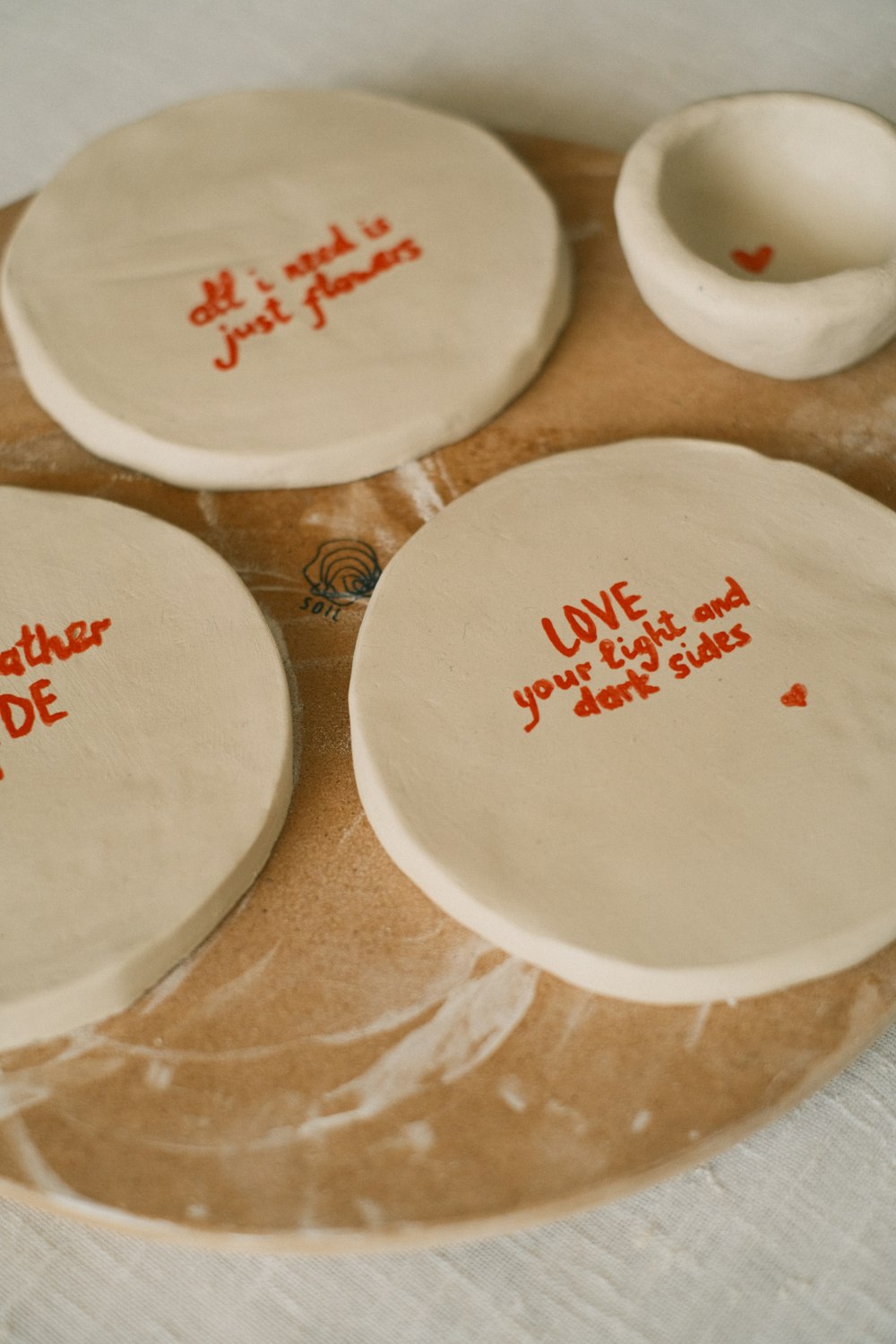 a couple of white plates sitting on top of a table