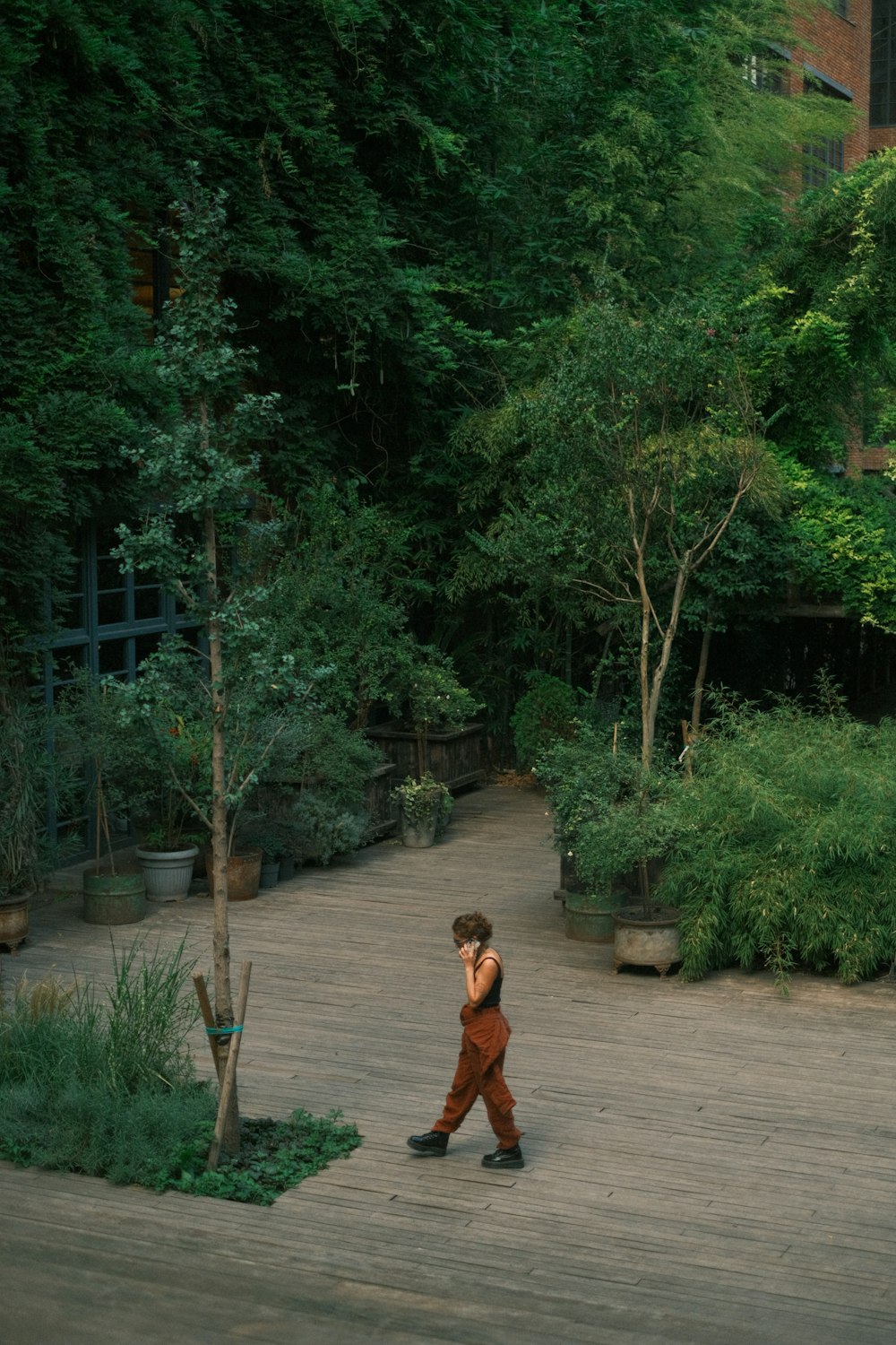 a person walking down a path in a park