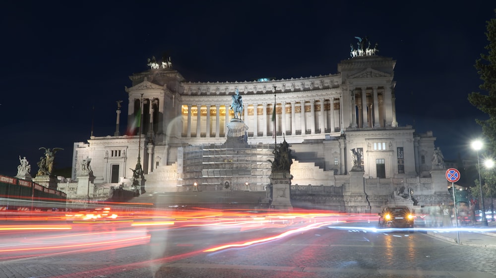 a large building with a lot of lights in front of it