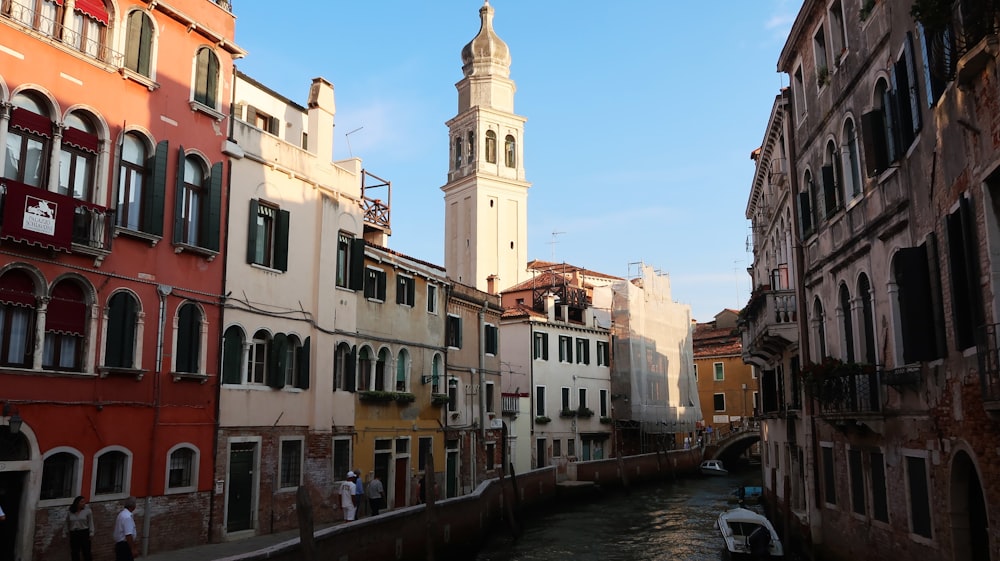 a river running through a city next to tall buildings