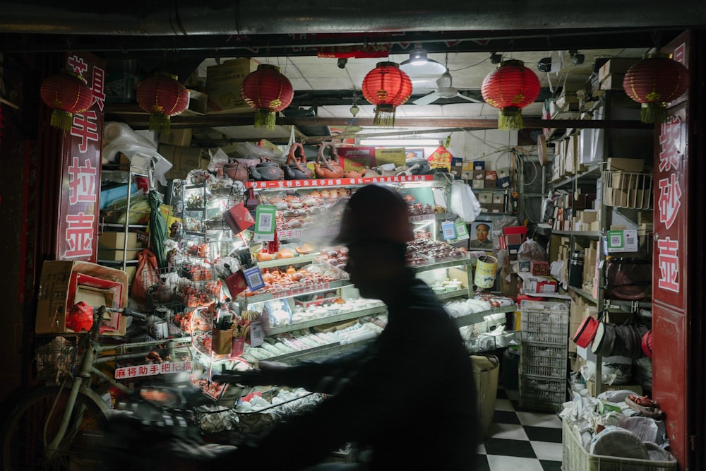 a person riding a bike in a store