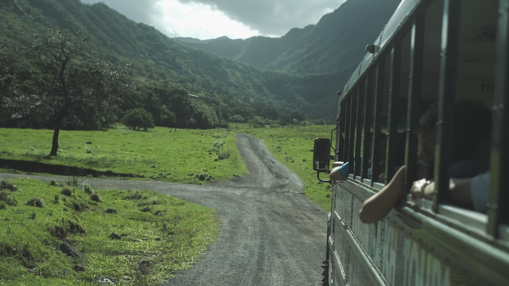 a person is looking out the window of a train