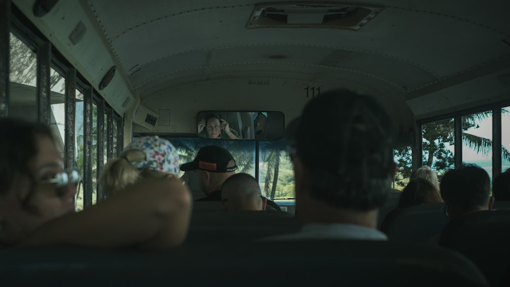 a group of people riding on a bus