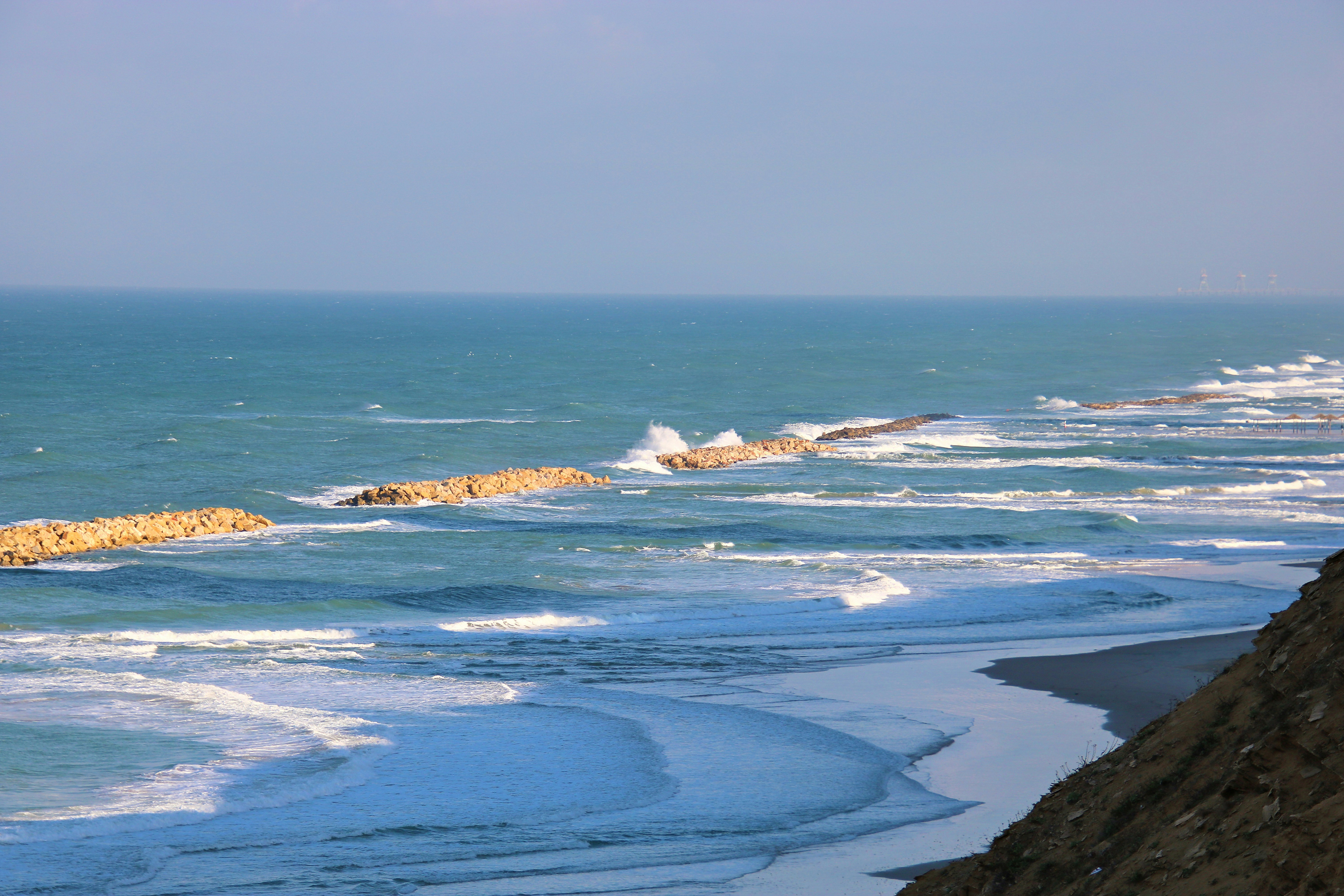 a view of the ocean from a cliff