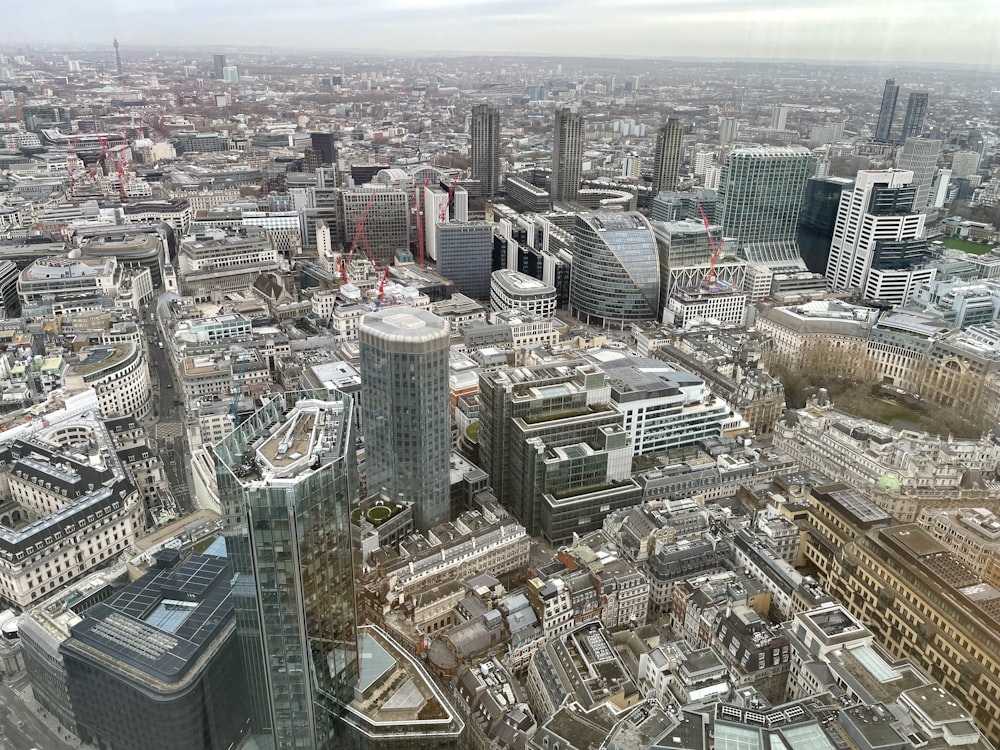 an aerial view of a city with tall buildings