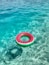 a watermelon ring floating in the ocean