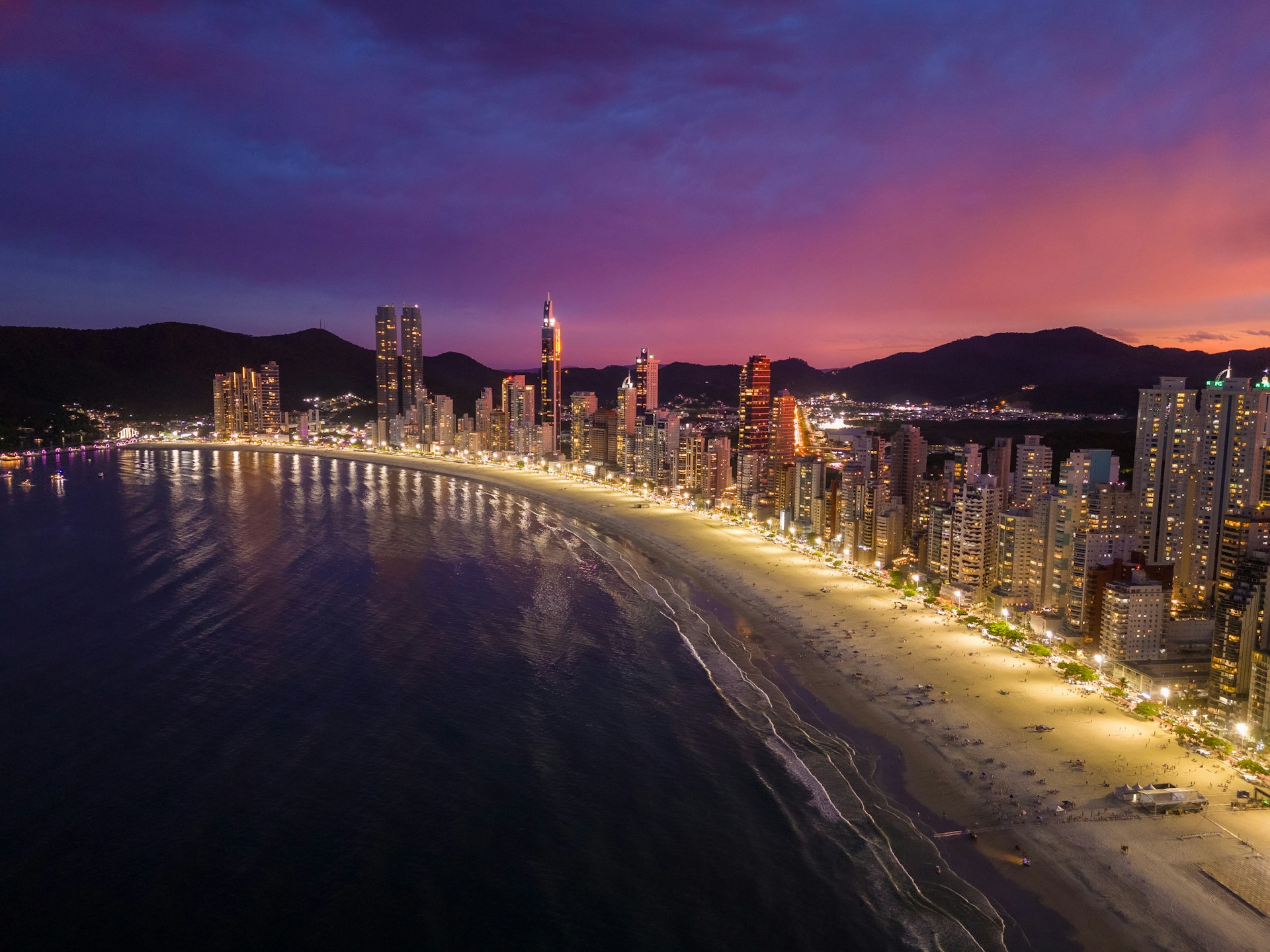 an aerial view of a city at night