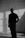 a man standing in a room with his hands in his pockets