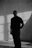 a man standing in a room with his hands in his pockets