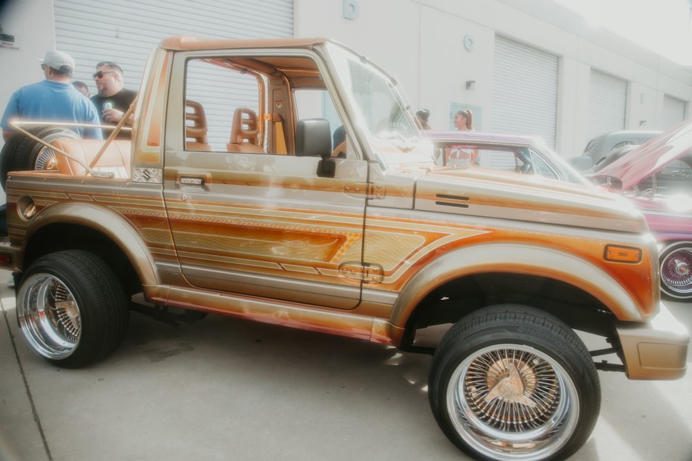 a pickup truck parked in a parking lot next to other cars