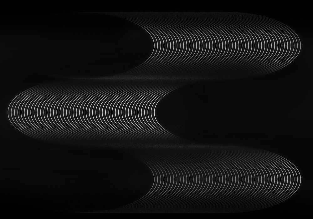 a black and white photo of three circles