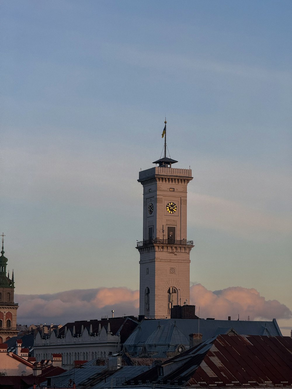 a tall clock tower towering over a city